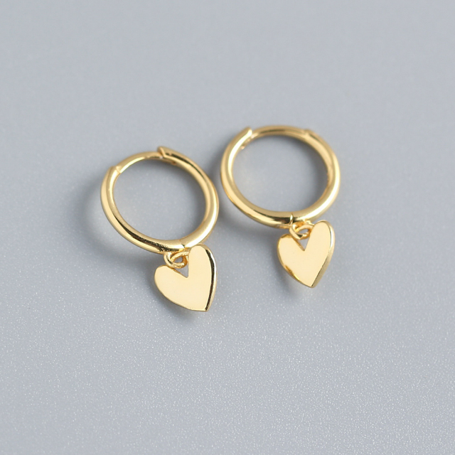 Heart charm huggie earring in gold