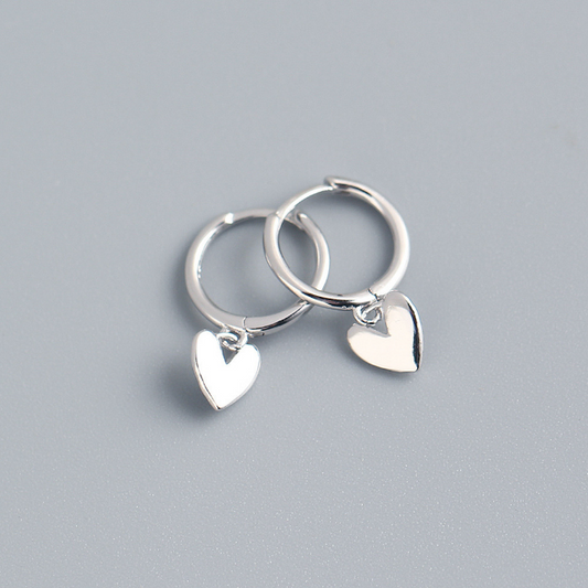 Heart charm huggie earring in silver